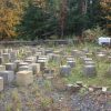 A gravel lot filled with concrete cubes being used for research purposes.