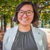 Picture of Dr. Doris Chow, St. Thomas University Psychology Professor, standing in the university's courtyard.